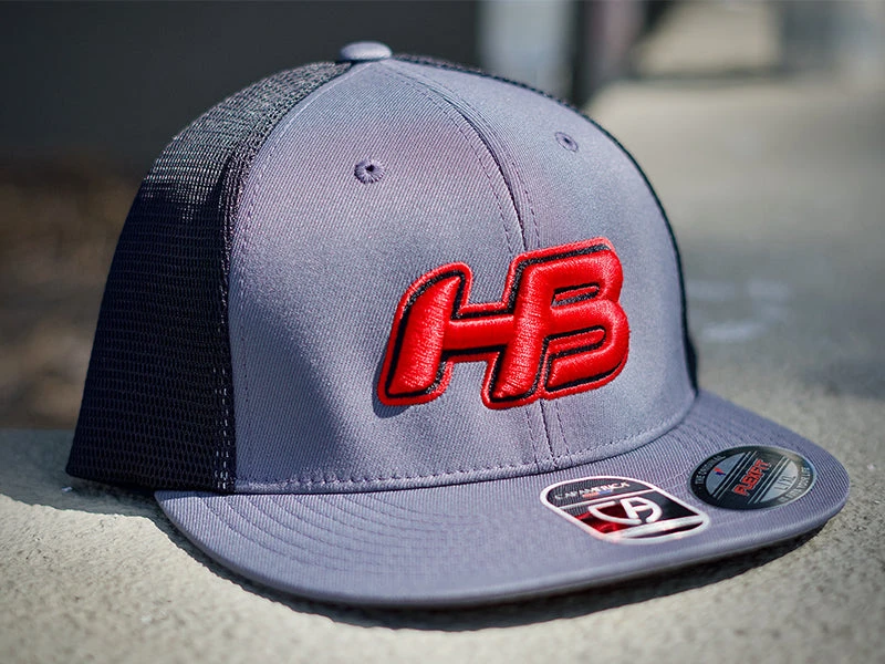 Headbanger Sports I8501 Cap America Flexfit Performance Trucker Mesh Back Hat: Graphite / Red 3 Headbanger Sports I8501 Cap America Flexfit Performance Trucker Mesh Back Hat: Graphite / Red
